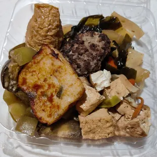 Cone sushi, hamburger, and fishcake on a bed of eggplant, nishime, and tofu