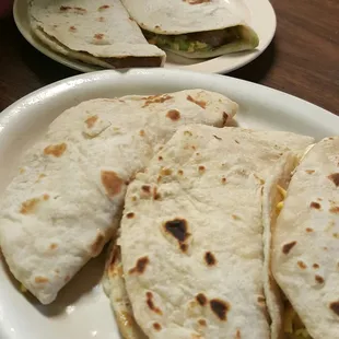 Carne guisada with cheese and country egg and cheese tacos
