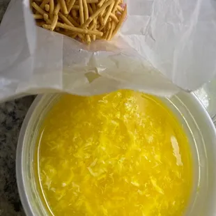 a bowl of soup and pretzels