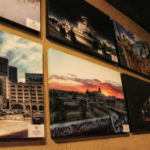 a cityscape with a sunset in the background