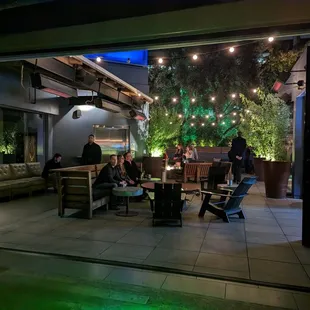 a group of people sitting around a patio