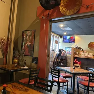 a restaurant with tables and chairs