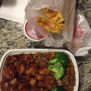 chicken, broccoli, and rice in a plastic container