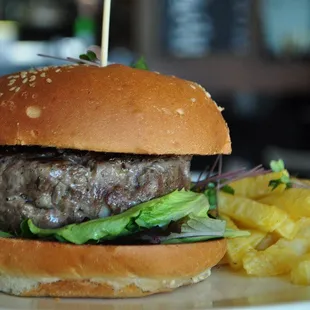 a hamburger and fries on a plate