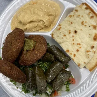 Appetizer combo (hummus, pita, tabbouleh, grape leaves, and falafel)