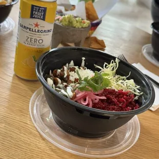 Beet and quinoa salad paired with their pork in a light green salsa.
