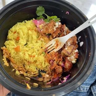 a person holding a bowl of food