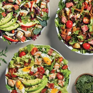 a variety of salads on a table