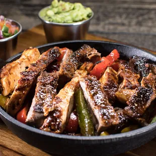 Carne Asada Fajitas.

Corn or flour tortillas, black beans, cilantro-lime rice, fajita veggies, sour cream, and guacamole.