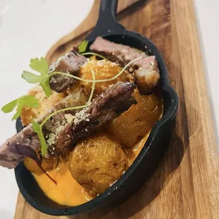 Delicious, steak, potatoes, and lovely cheese sauce