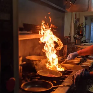 a man cooking in a kitchen