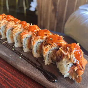 a sushi roll on a wooden board
