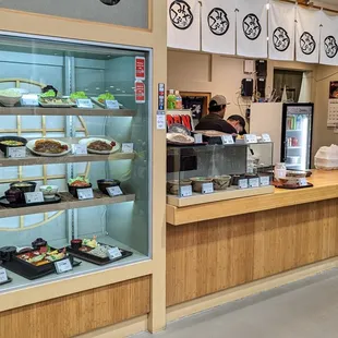 a woman standing in front of the counter
