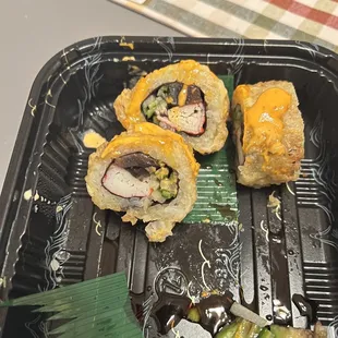 Spicy California roll with horrific looking avocado.