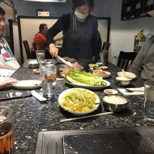 a group of people sitting around a table