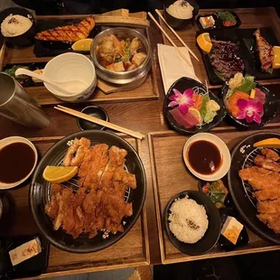 Teishoki meals including: chicken katsu, sashimi, beef teriyaki, chicken sukiyaki, and salmon teriyaki
