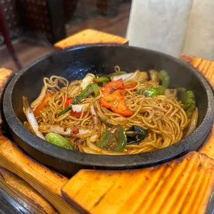 a bowl of noodles and vegetables