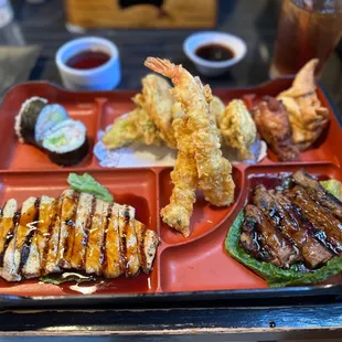 a bento tray with a variety of food items