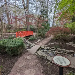 This is a marker commemorating the stone bridge and a view of that bridge.  Photo taken March 25, 2023.