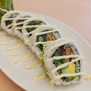 a plate of sushi rolls
