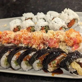 a plate of sushi rolls