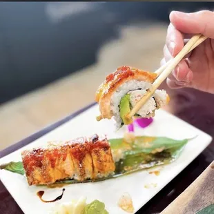 a person eating sushi