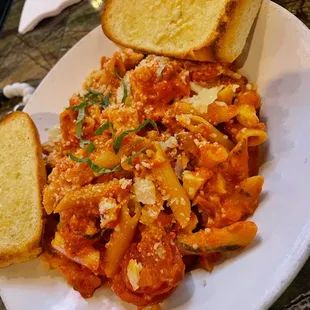 a plate of pasta and bread