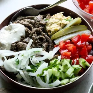 a bowl of chopped vegetables and meat