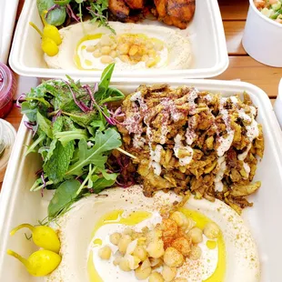 two trays of food on a table