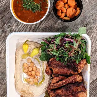 Chicken pargiyot with hummus, spicy carrots and lentil soup. So good.