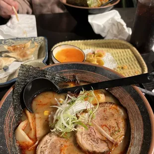 a bowl of soup with meat and vegetables