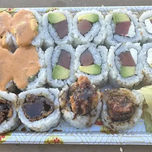 a tray of sushi with various toppings