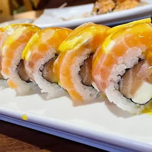 a sushi roll on a white plate