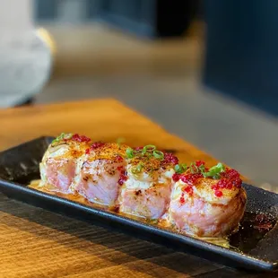 Dallas Special: huge balls of crab meat, wrapped in salmon and topped with scallop and sauce. all torched to perfection. Super delicious!