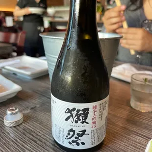 a bottle of sake on a table