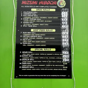 a menu on a green wall