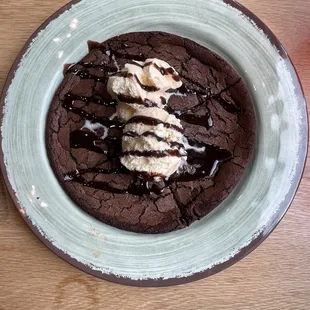 Chocolate cookie bar with ice cream and chocolate fudge topping.