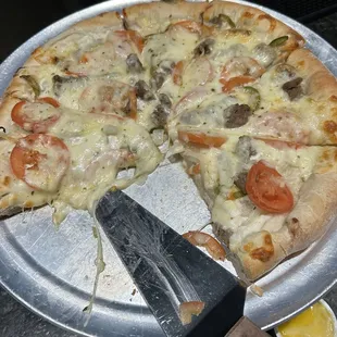 a pizza with a slice missing