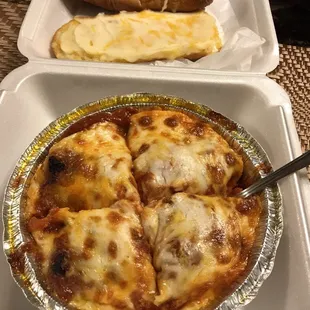 Phenomenal baked lasagna with cheese on the garlic toast!