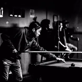 a man playing pool