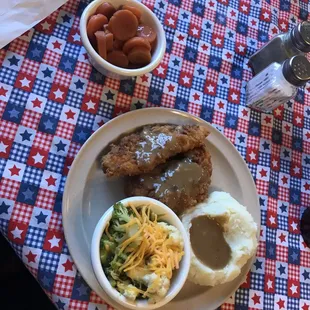 Our chicken tenders, mashed potatoes, steamed broccoli, and skillet carrots!