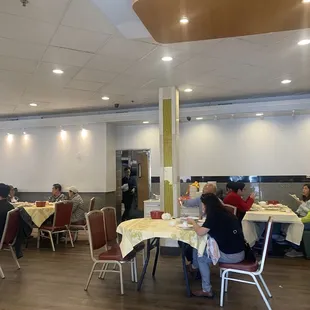 a large group of people sitting at tables