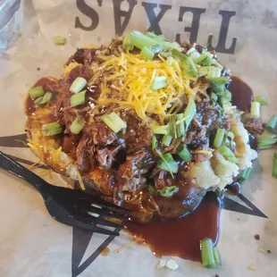 Baked potato, a little tube of sour cream comes with this too in the side.