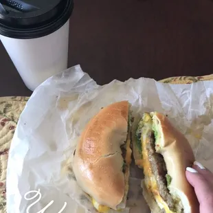 Sausage, egg, and cheese with avocado on a plain bagel.