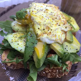 a sandwich with avocado and eggs