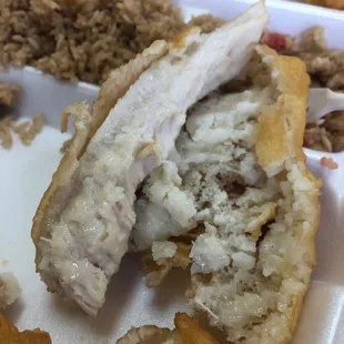 a half eaten chicken sandwich