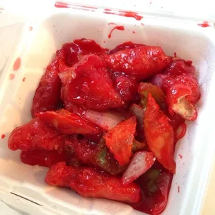 Neon red sweet and sour chicken