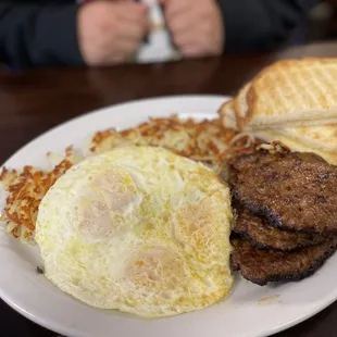 3 eggs, 3 sausage patties, toast and hash browns