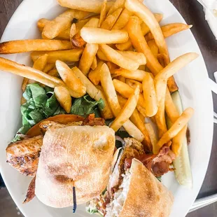 Club sandwich on Shibata bread and a side of fries