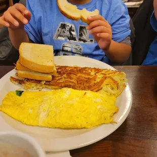 My son got the Cheese omelet, hash browns, and toast